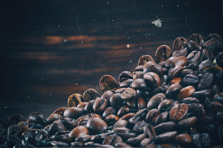 Vintage photo of coffee beans on a stone backgroundの写真素材