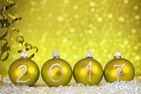 New year 2017 text on christmas baubles