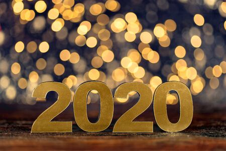 Happy New Year 2020. Symbol from number 2020 on wooden backgroundの写真素材