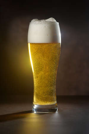 Beer.Pint of Beer close up isolated on abstract background. Cold Craft light Beer in a glassの写真素材