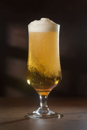 Beer.Pint of Beer close up isolated on abstract background. Cold Craft light Beer in a glassの写真素材