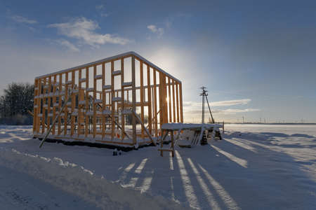 New residential construction of wooden frame house cold winter weatherの写真素材