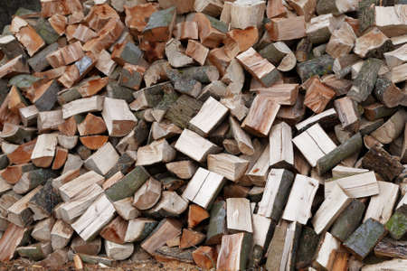 A pile of chopped firewood ready for stackingの写真素材