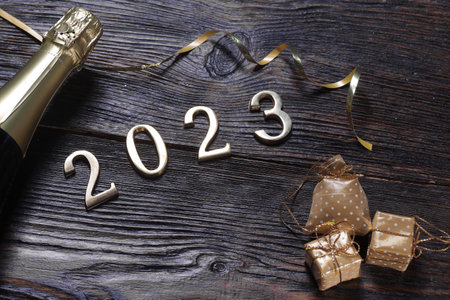 Happy New Year. Symbol from number 2023 on wooden background