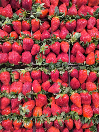 Strawberries background. Fresh red strawberries for sale in the marketの写真素材