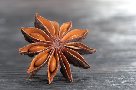 Star anise spice on wooden background, close up, shallow depth of fieldの写真素材