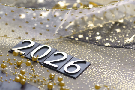 New Year on the background of a beautiful fabric with gold beads