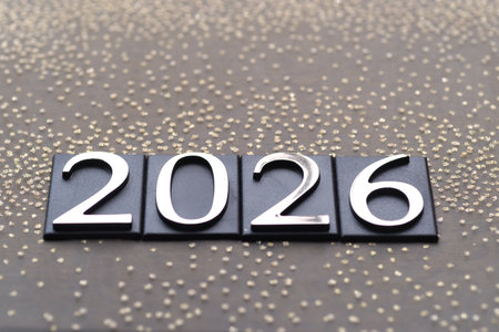 Numbers on the background of gold sequinsの写真素材