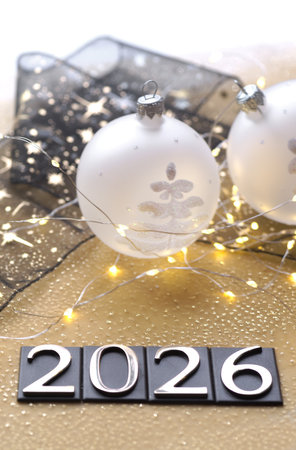 New Year's Eve decoration with baubles, lights and gift boxの写真素材