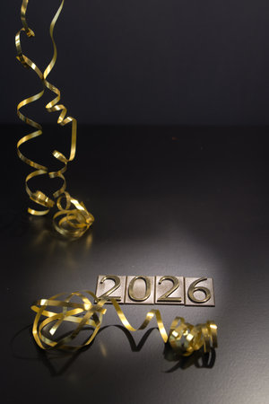 New Year's Eve celebration with golden serpentine and gold confettiの写真素材
