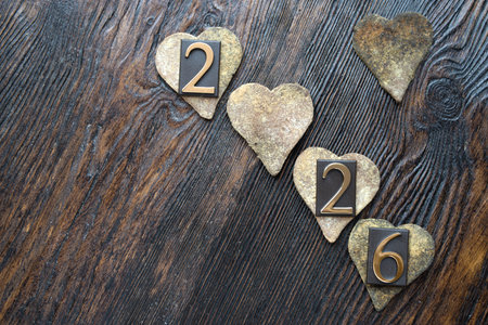 Happy New Year 2016 with heart on vintage wooden background, copy space for your textの写真素材