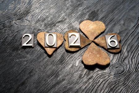 Happy New Year 2016. Wooden hearts on a black wooden background.の写真素材