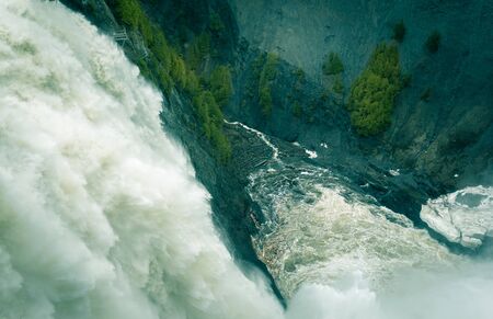 Impressive Montmorency waterfall rushing downwards slanted angle, diagonal composition
