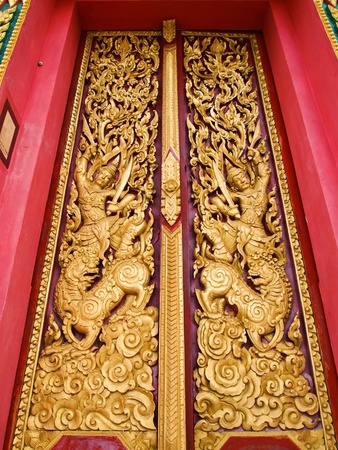 Buddha carved gold paint on church doorのeditorial素材