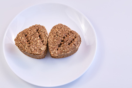wheat germ bread and rye on a white round plate. healthy food. homebaked bread.の写真素材