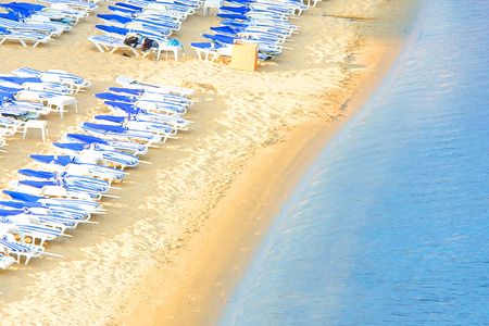 Empty Beach With Lounge Chairsの写真素材