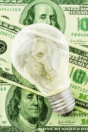 Business Idea (Light Bulb Over Banknotes)の写真素材