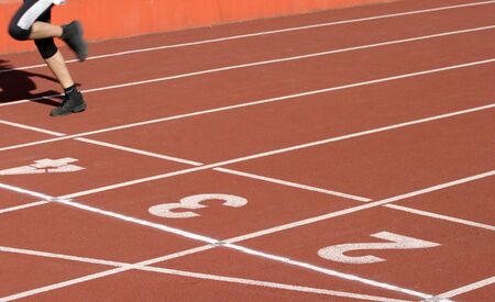 close up runners on on finishing line