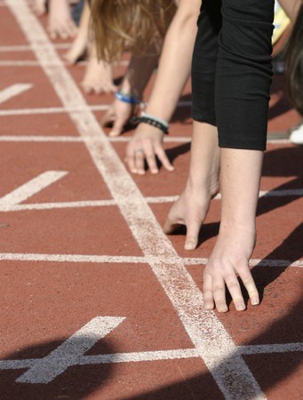 close up o hands on starting line
