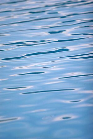 close up of blue water waves in pool