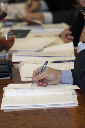close up of conference meeting notebooks and documents