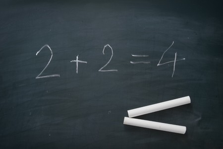 close up of chalk and numbers on blackboard の写真素材