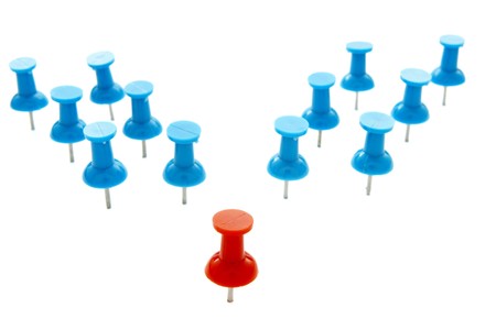 close up of red and blue push pins on white background with pathの写真素材