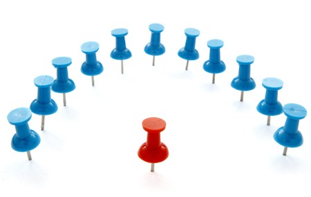 close up of red and blue push pins on white background with pathの写真素材