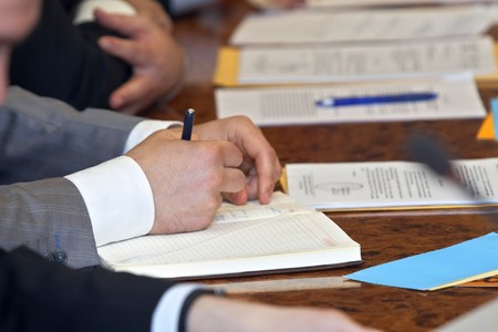 close up of conference meeting businessmen hands