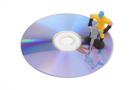 close up of cd failure and toy worker on white background with pathの写真素材