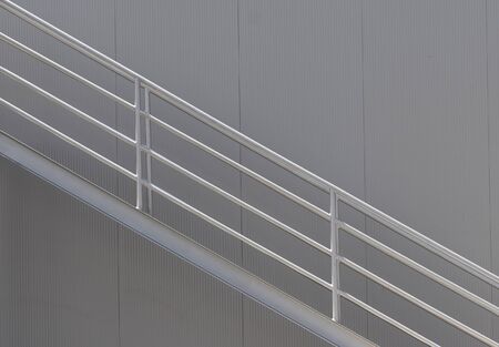 architectural detail of metal stairs and wall