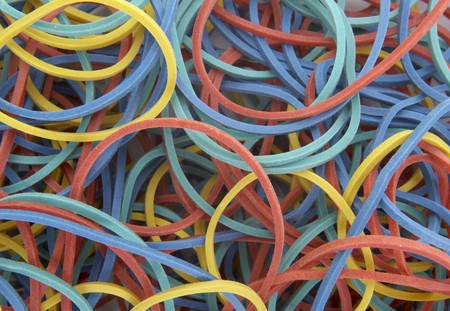 close up of rubber band ball on white background
