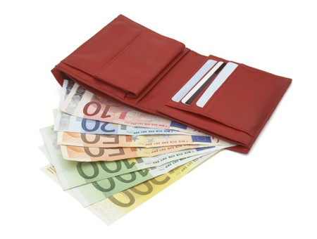 close up of wallet and euro on white background 