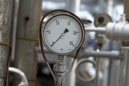 close up of industrial pipes and measurer of compressionの写真素材