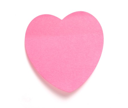 close up ofheart shaped reminder on white background の写真素材