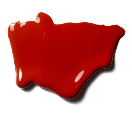 close up of colorful paints leaking down on white background の写真素材