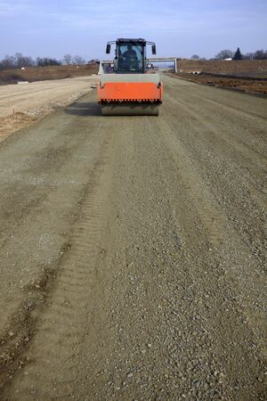 road roller leveling new asphalt on road