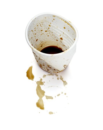 close up of empty used coffee cups on white background の写真素材