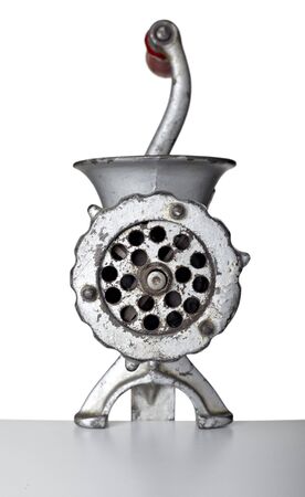 close up of meat grinder on white background の写真素材