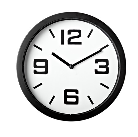 close up of an office clock on white background close up of an office clock on white background