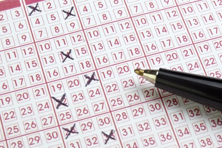 close up of lottery ticket and penの写真素材