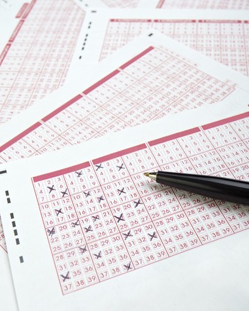 close up of lottery ticket and penの写真素材