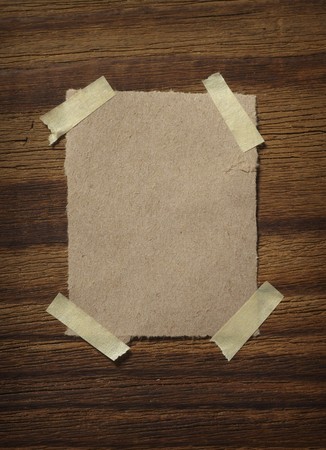 close up of grunge note paper on wooden backgroundの写真素材