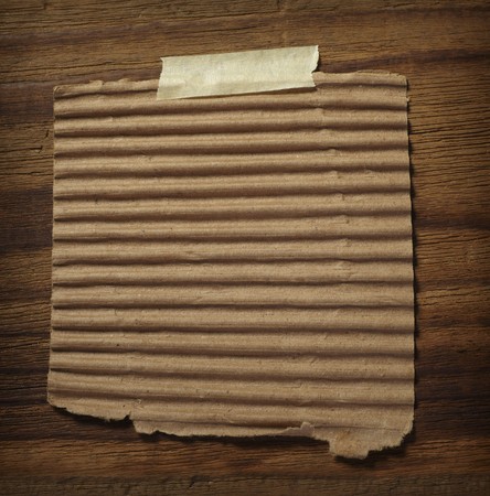 close up of grunge note paper on wooden backgroundの写真素材