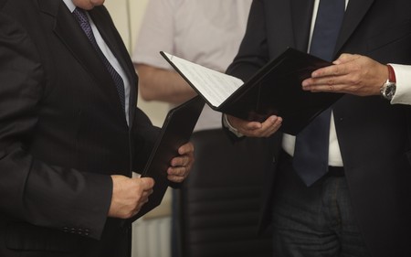 close up of businessman hands signing contractの写真素材