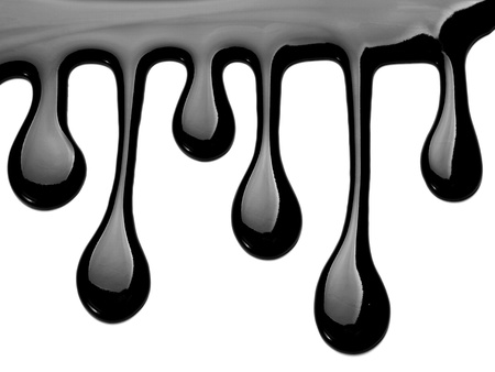 close up chocolate syrup leaking on white backgroundの写真素材