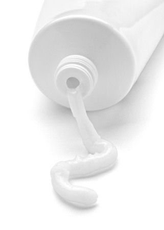 close up of a blank white cream tube on white background close up of a blank white cream tube on white background