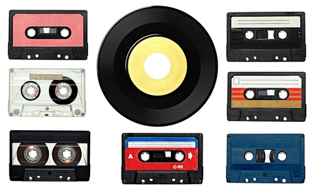 collection of various vintage audio tapes and a vinyl disc on white background. each one is shot...