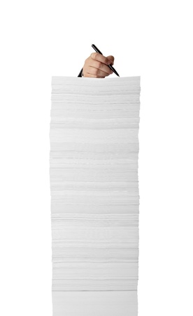 close up of businessman hand writing on stack of papers on white background の写真素材