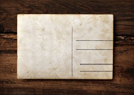 close up of an old photo on a wooden backgroundの写真素材